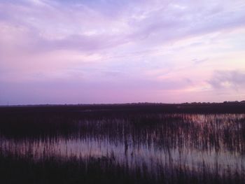 Scenic view of lake at sunset