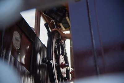 Close-up of padlocks hanging on metal wall