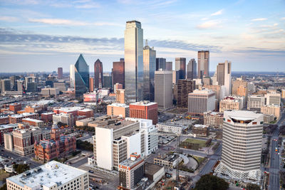 Aerial view of modern buildings in city against sky