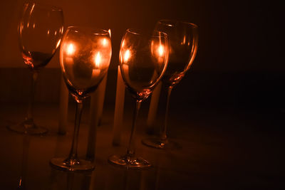 Close-up of wine glasses on table