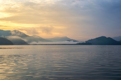 Scenic view of lake against sky during sunset