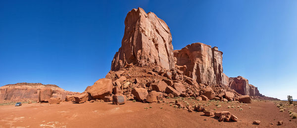 Rock formations against clear blue sky