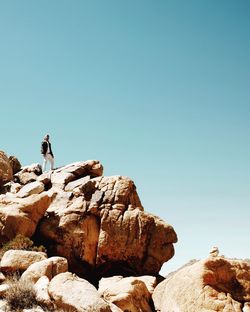 Rock formations against clear blue sky