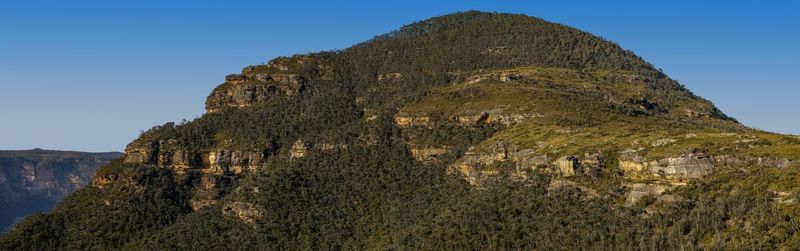 Low angle view of rock formation against sky