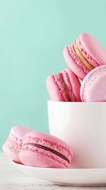 Close-up of pink cake against white background