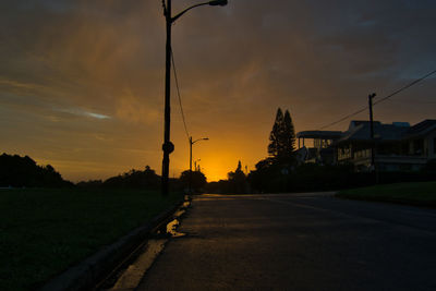 Street against sky during sunset