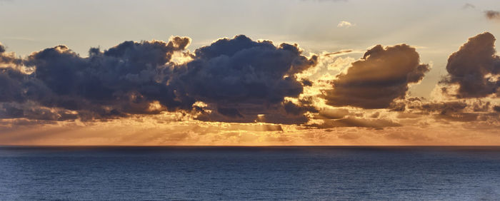 Dramatic sunset at sea. cloudy landscape. banner