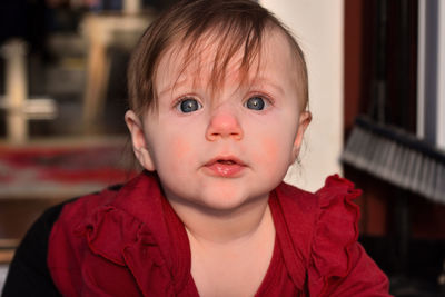 Close-up of cute baby boy at home