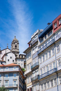 Buildings in city against sky