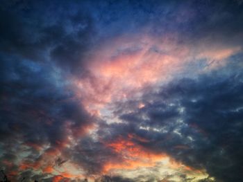 Low angle view of dramatic sky during sunset