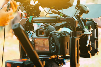 Cinema camera on film set, behind the scenes background, film crew production