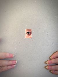 Woman looking through cardboard