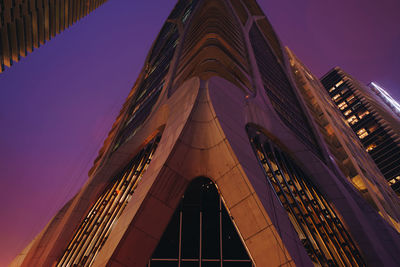 Low angle view of illuminated building against sky