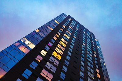 Low angle view of office building against sky