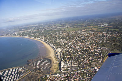 Aerial view of cityscape against sky