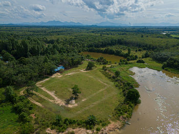 High angle view of trees on land against sky