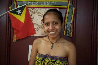 Portrait of smiling girl standing indoors