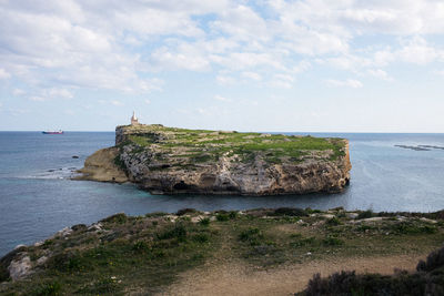 Scenic view of sea and rocks against sky