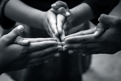 Close-up of children's hands playing