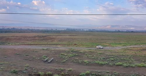 Scenic view of field against sky