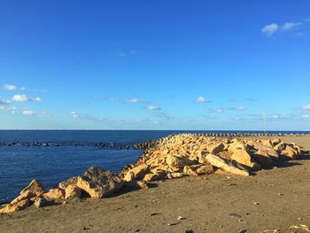 Scenic view of sea against blue sky