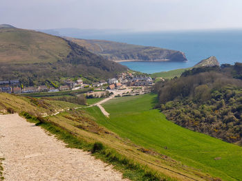 Scenic view of landscape and sea against sky