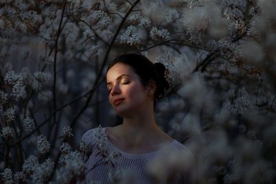 Portrait of a young woman looking away