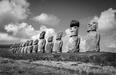 Low angle view of statues against sky