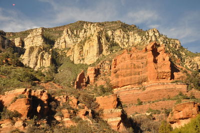 Scenic view of cliff against sky