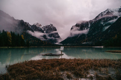 Scenic view of lake and mountains against sky