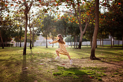 Side view of a woman in a tree