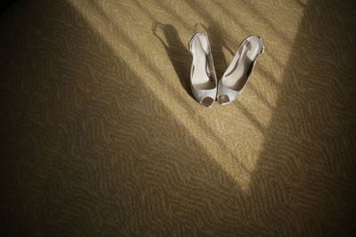 High angle view of sandals on carpet