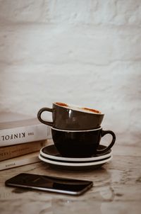 Close-up of coffee cup on table