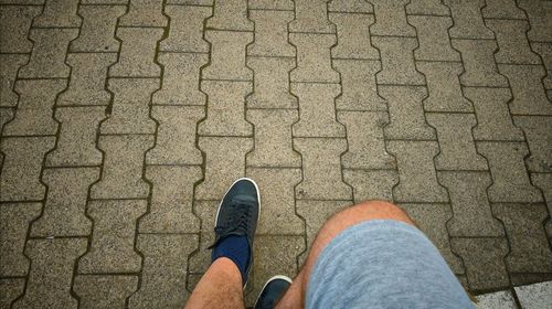 Low section of man standing on floor