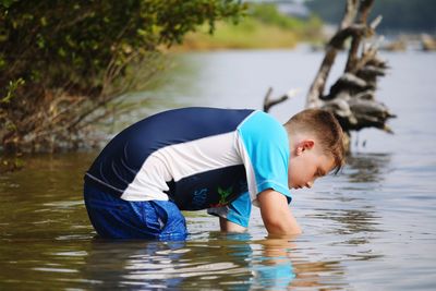 Side view of boy in water