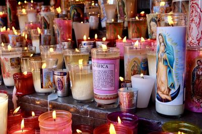 Traditional virgin mary candles lit at the basilica of our lady of guadalupe