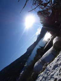 Low angle view of tree mountain against sky