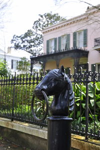 Close-up of horse statue by water
