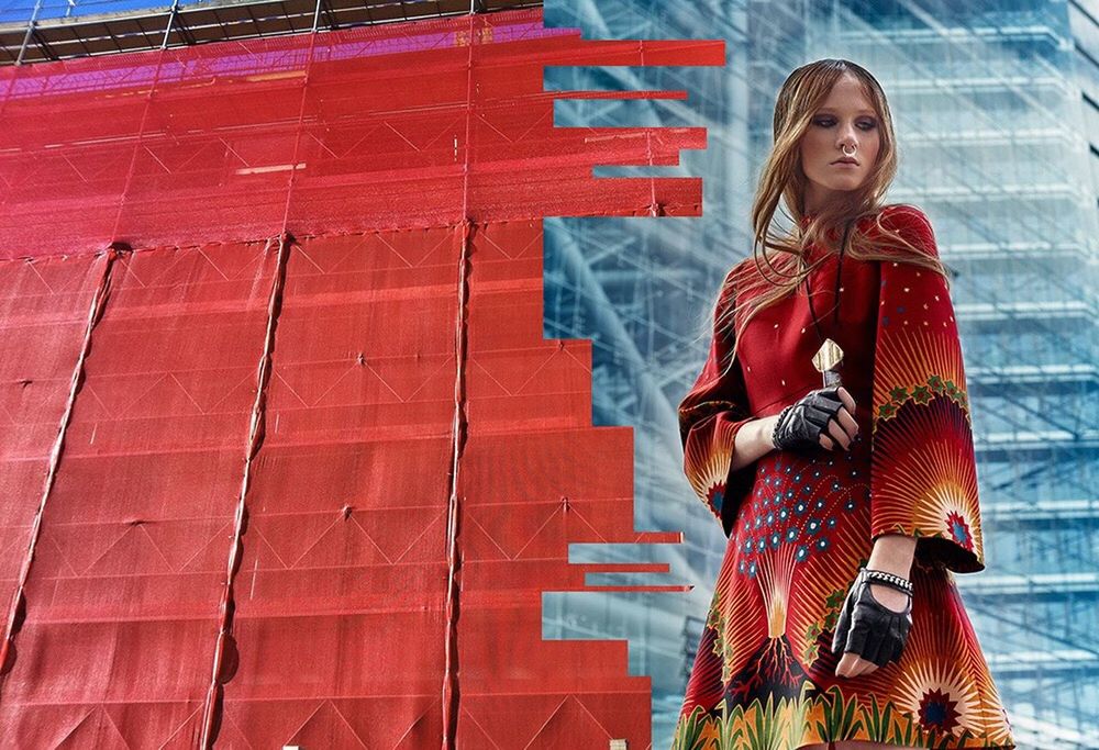 YOUNG WOMAN WITH RED UMBRELLA ON THE WALL