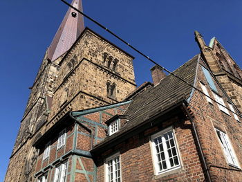 Low angle view of old building against clear sky