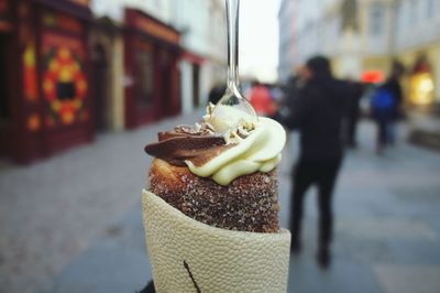 Close-up of dessert against street