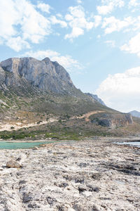 Scenic view of landscape and mountains against sky