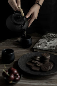 Cropped hand of man working on table