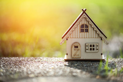 Close-up of model home on field