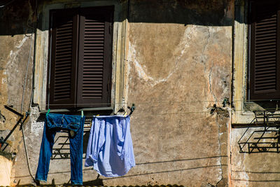 Clothes drying against old building