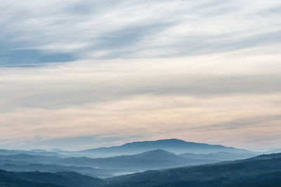 Scenic view of mountains against sky during sunset