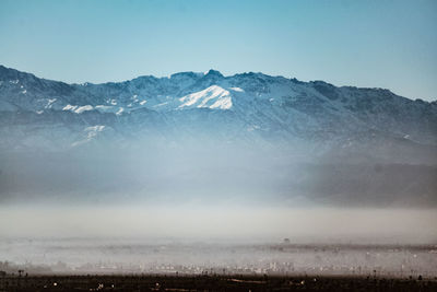 Scenic view of mountains against sky during winter