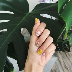 High angle view of woman hand with tattoo