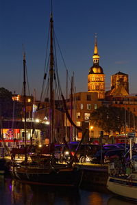 Boats moored at harbor