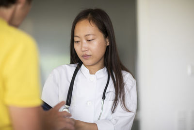 Young asia female doctor woman with patientwith report in a practice